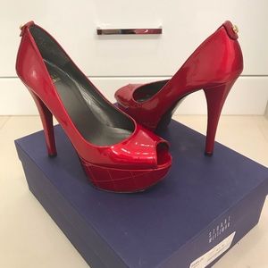 Stuart Weitzman Red Quasar elevate heels.